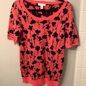 Motherhood cute sweater with pink and black flower pattern